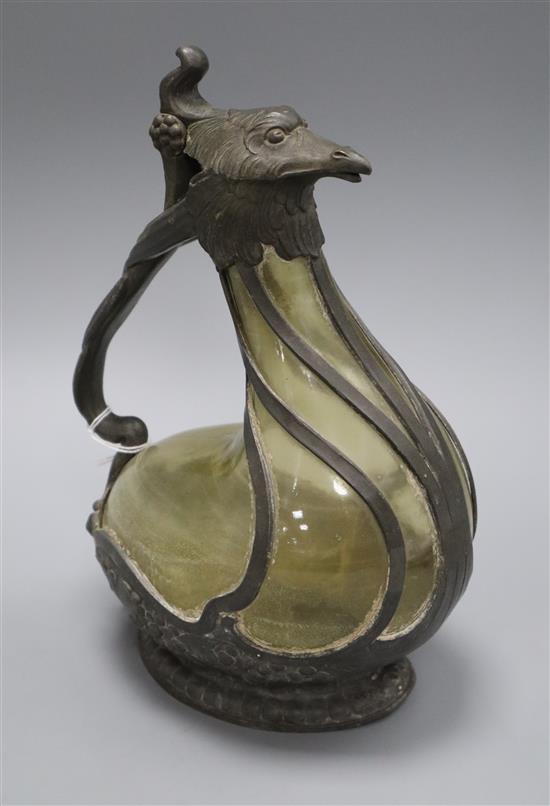An early 20th century pewter mounted glass bird claret jug height 25cm